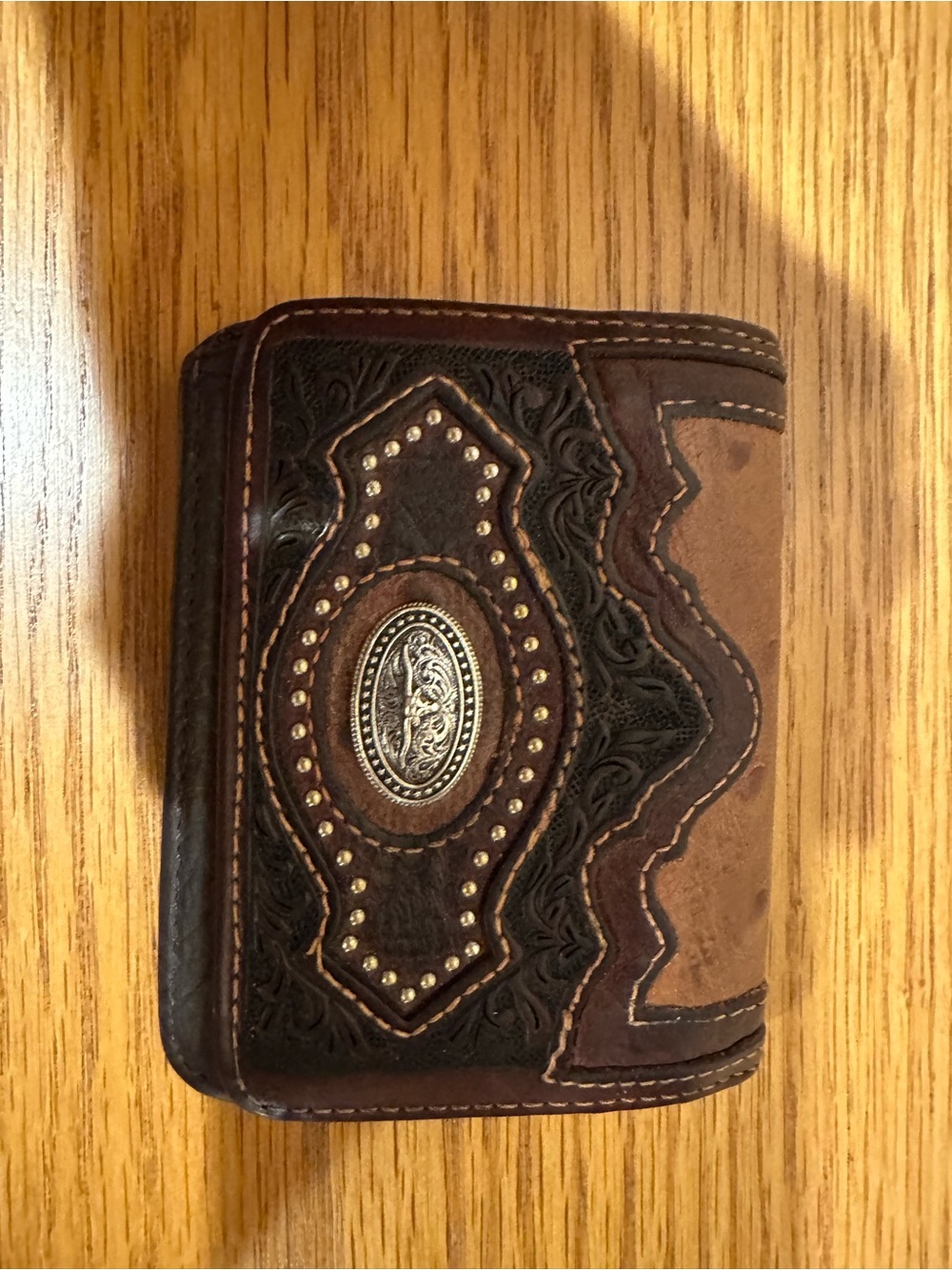 Brighton Two-Tone Brown Tooled Leather Bifold Wallet with Silver Medallion